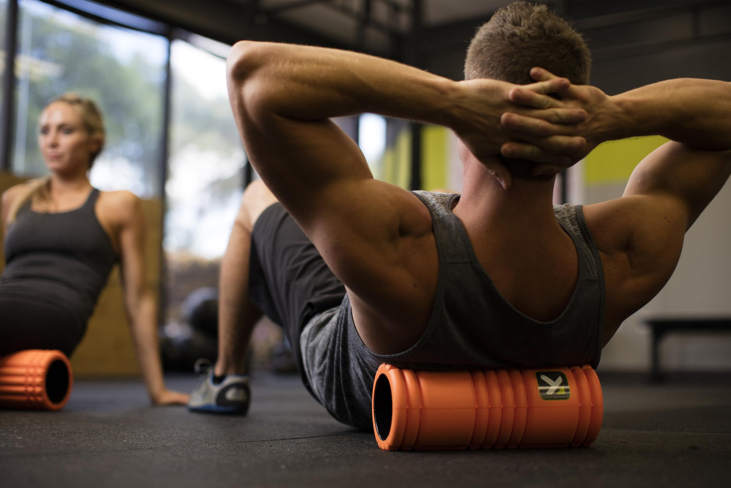 TriggerPoint Grid Foam Roller - Multi-Density Exterior, Rigid Core - Trusted by Therapists and Athletes - Standard Density, includes Online Instructional Videos